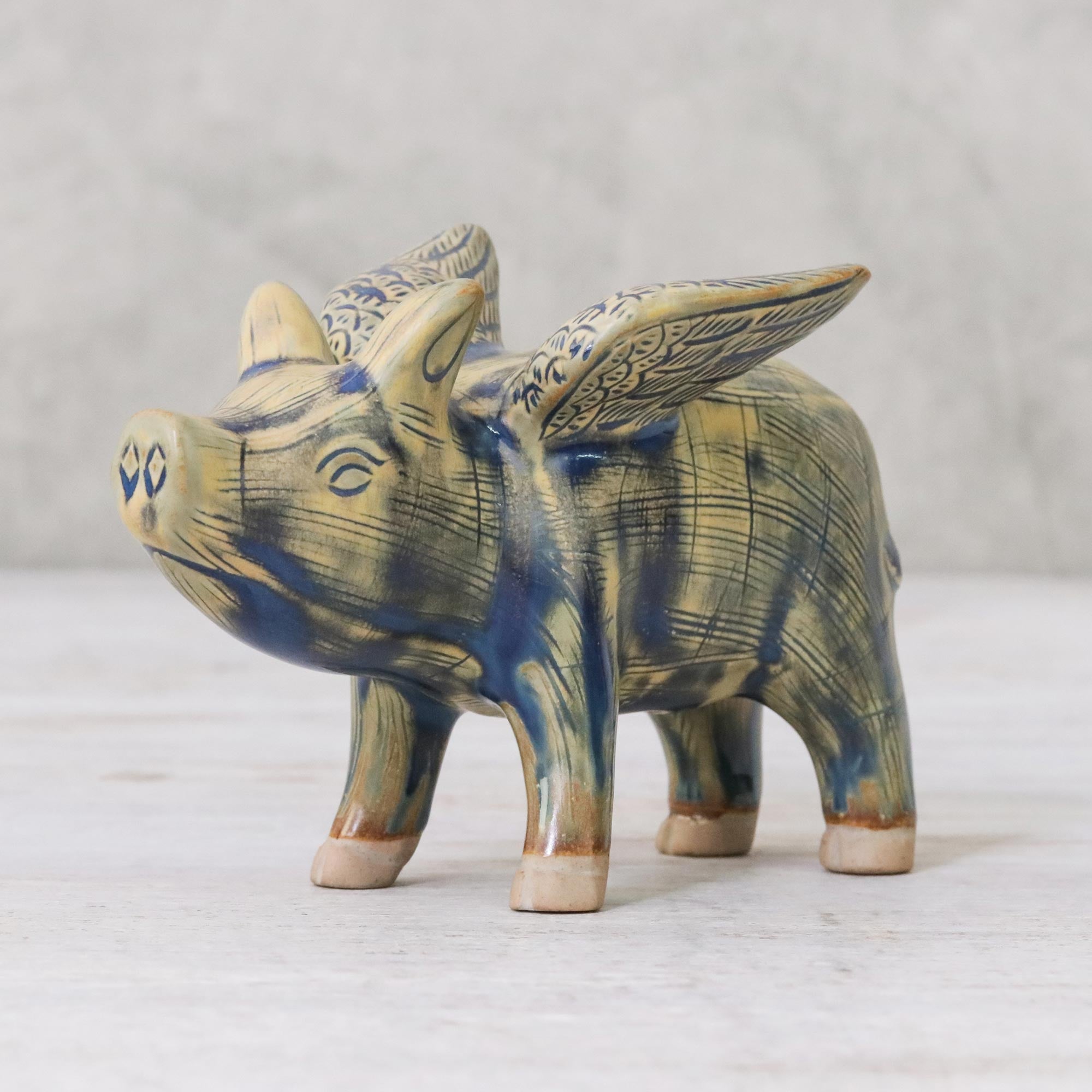 Premium Handcrafted Celadon Ceramic Flying Pig Figurine in Mustard & Blue