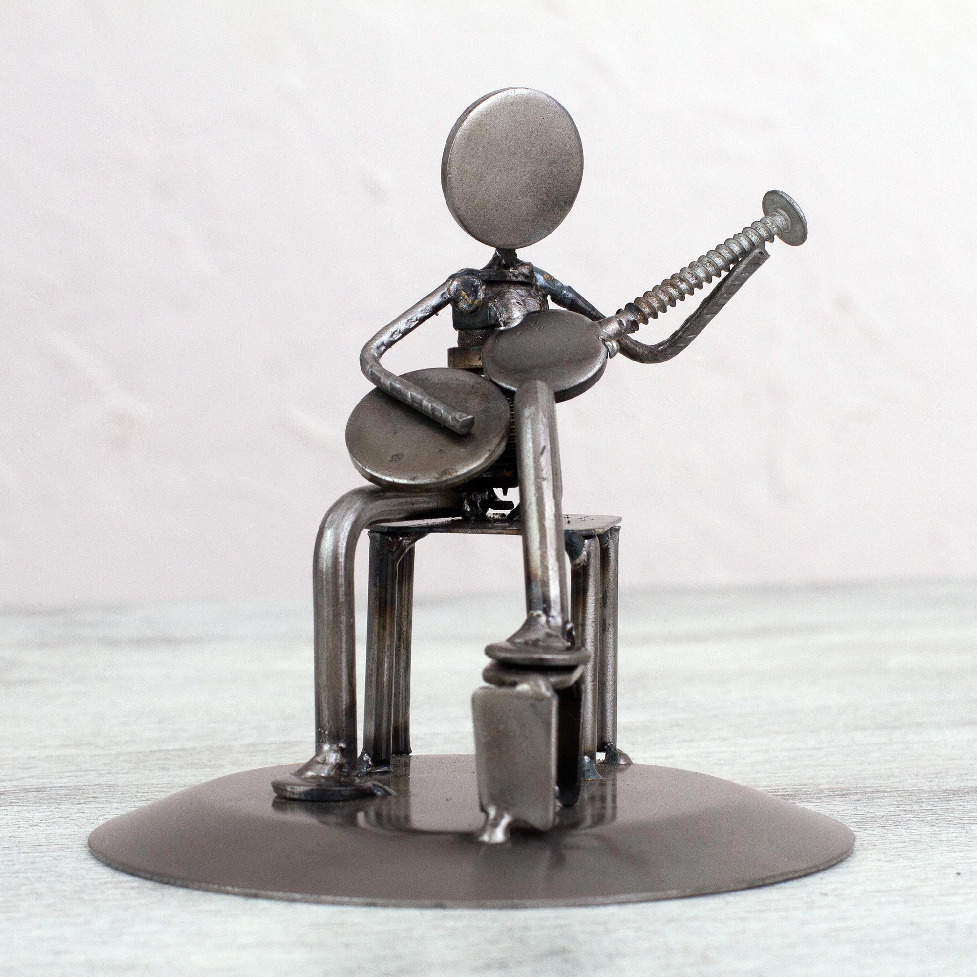 Premium Eco-Friendly Guitarist Sculpture: Rustic Auto Parts Art