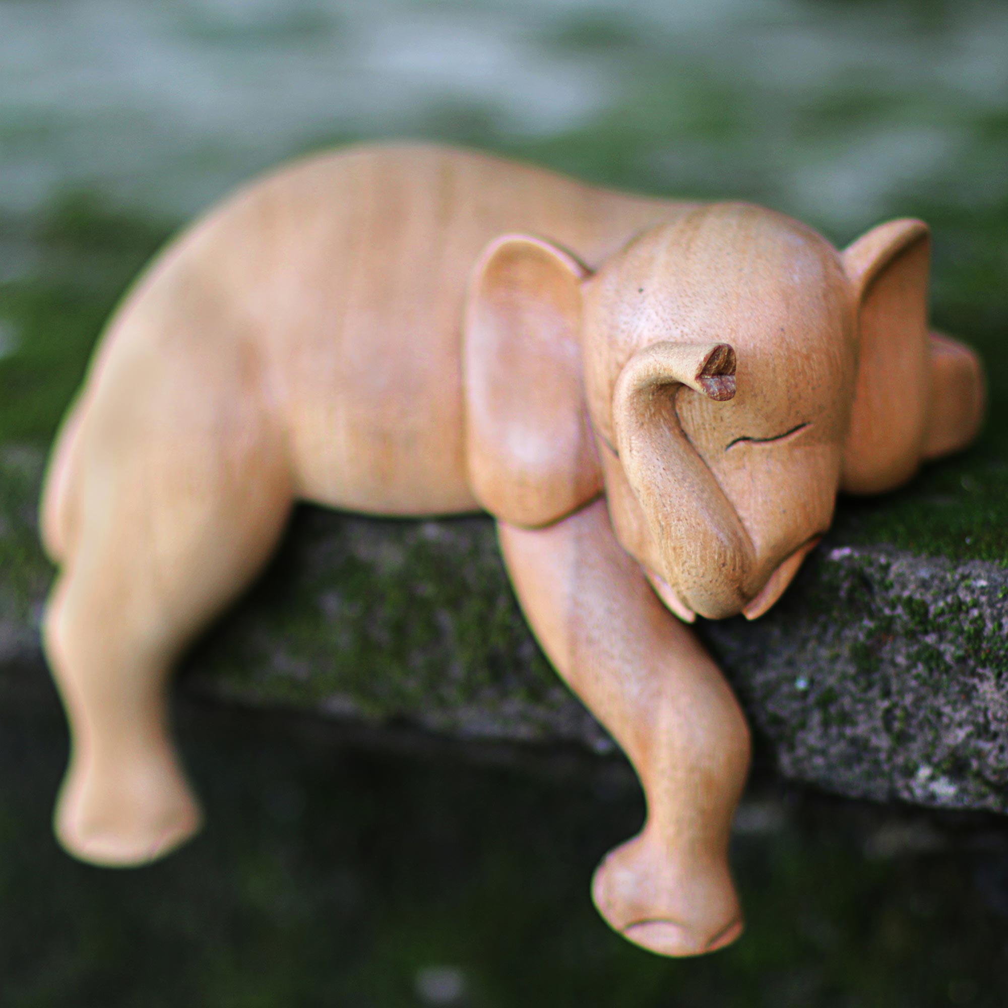Premium Hand-Carved Napping Elephant Sculpture - Natural Finish from Indonesia