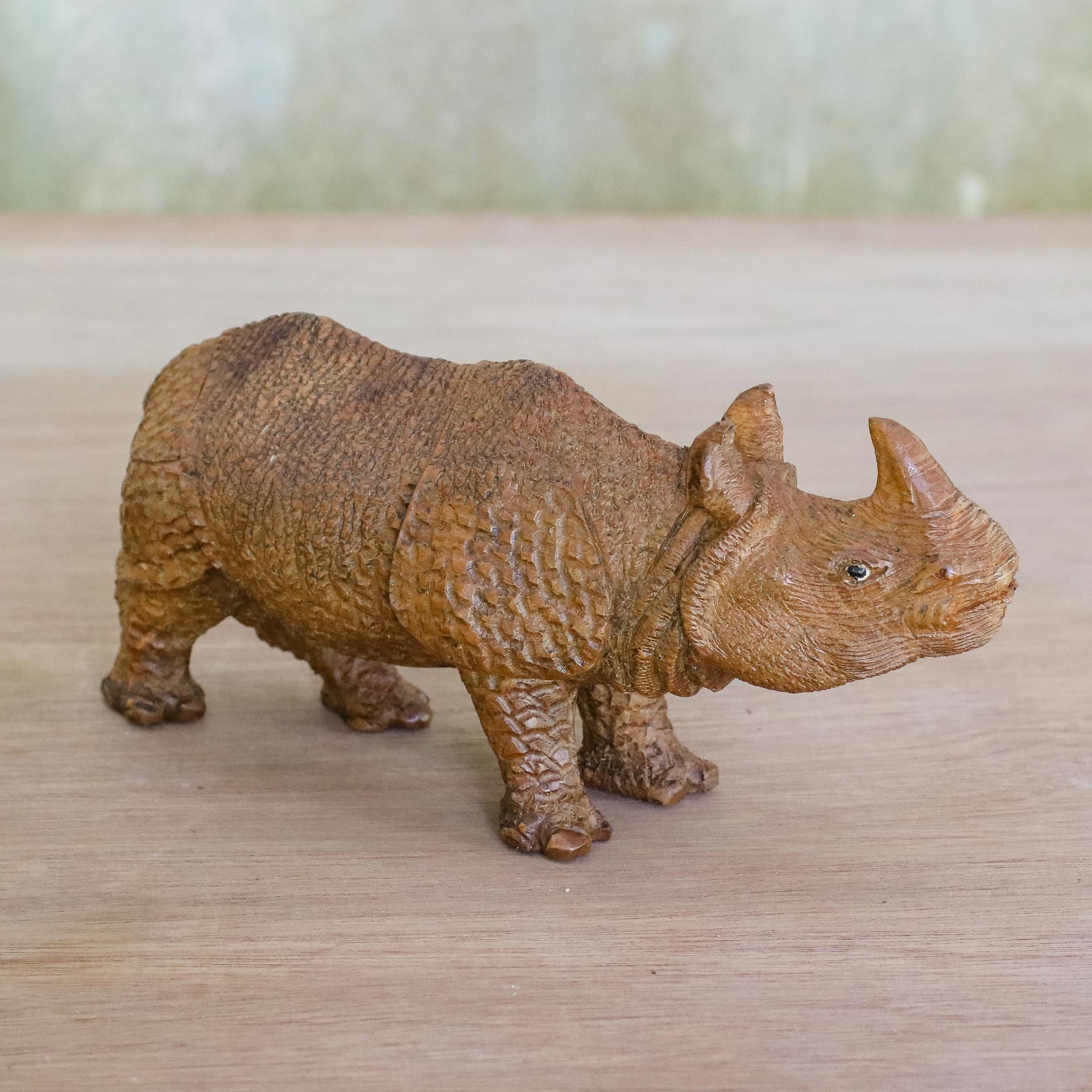 Premium Hand-Carved Raintree Wood Rhinoceros Sculpture – Curious Rhino Collection